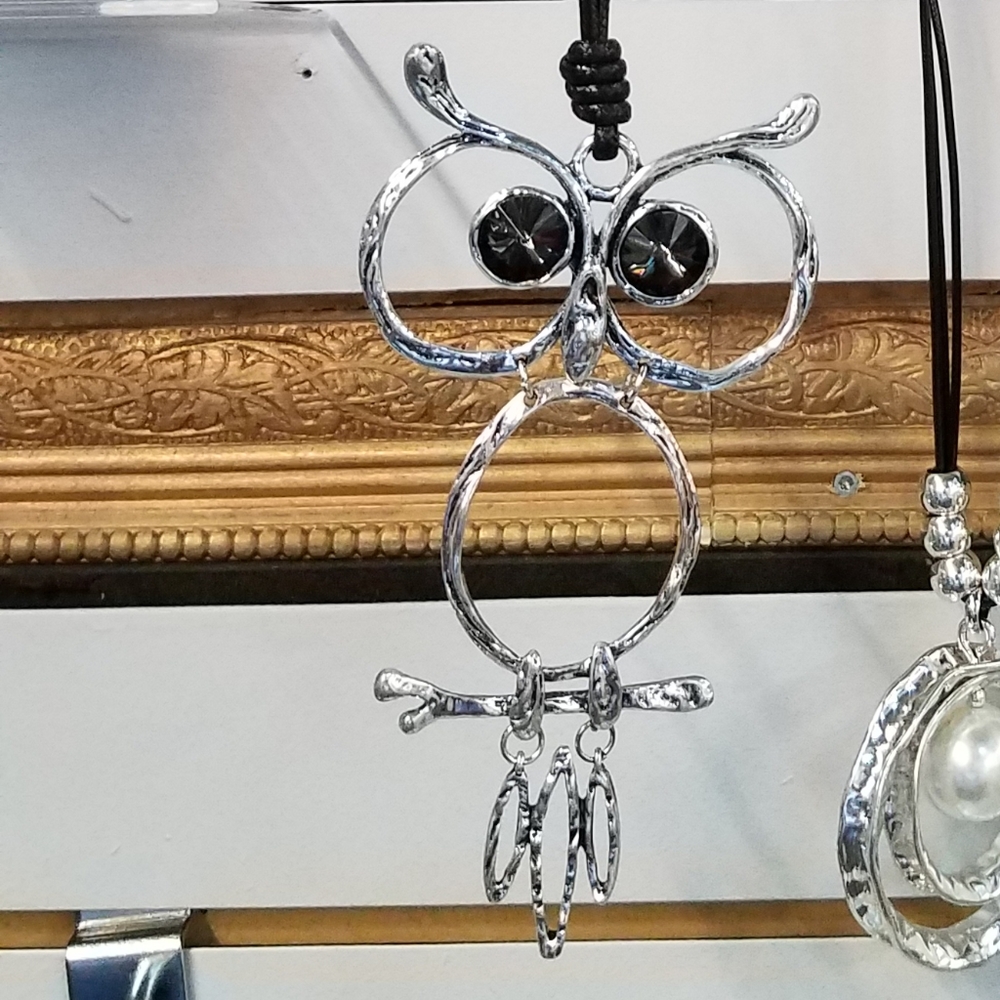 Silver Owl necklace on 36" leather cord.